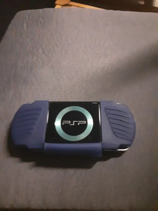 PSP Negra con funda azul