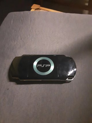 PSP Negra con funda azul