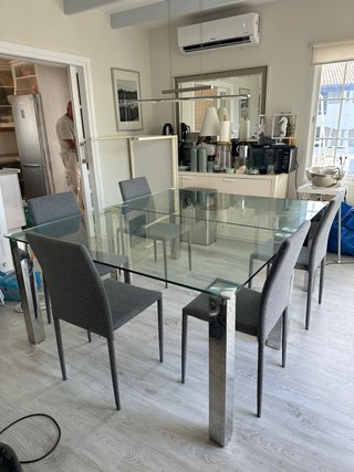 Mesa de comedor de cristal y 6 sillas