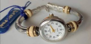 Reloj Calipso y 5 Pins Getxo
