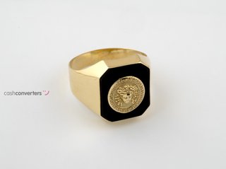 sello oro 18k con piedra con onix