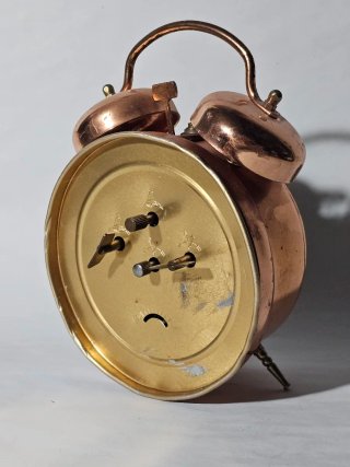 Sveglia con orologio Insa in rame antico