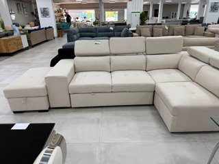 Sofá cama elegante con puff