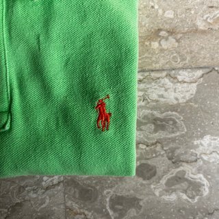 Polo verde con logo cavallino arancione 14-16y