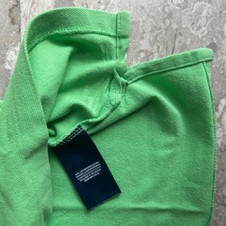 Polo verde con logo cavallino arancione 14-16y
