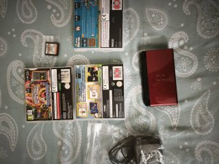 Nintendo DS Lite Rossa + Accessori, leggi l'annuncio