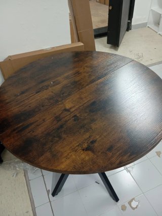 Mesa redonda de estilo industrial con tablero