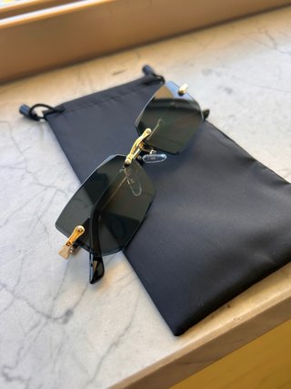 Occhiali da sole senza montatura oro nero