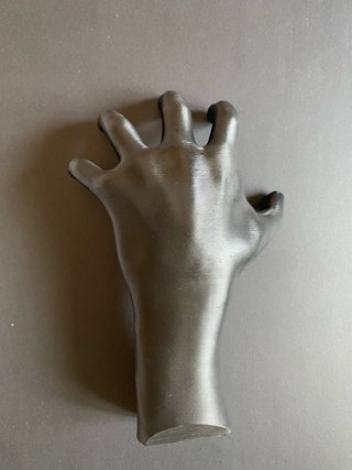 Supporto a forma di mano per palloni