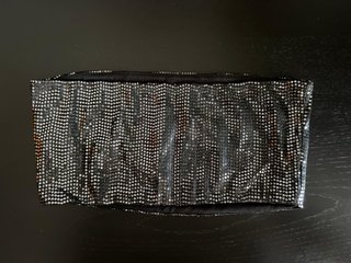 Top brillante negro y plateado