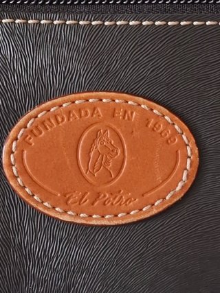 Bolso El Potro negro y marrón cuero.