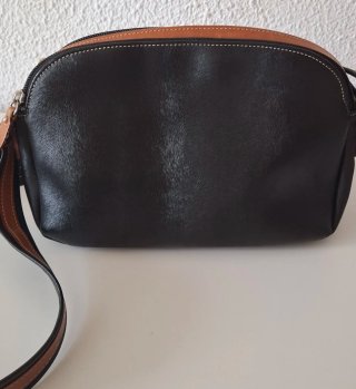 Bolso El Potro negro y marrón cuero.
