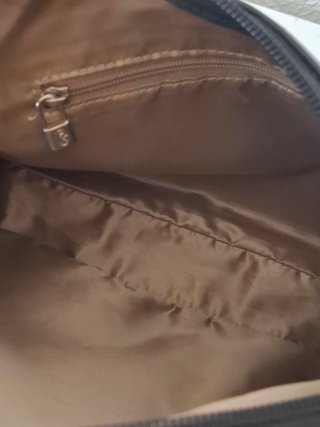 Bolso El Potro negro y marrón cuero.