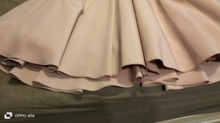 Vestido midi rosa con vuelo y cinturón