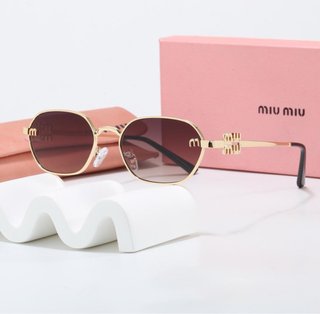 Occhiali da sole Miu Miu dorati e marroni