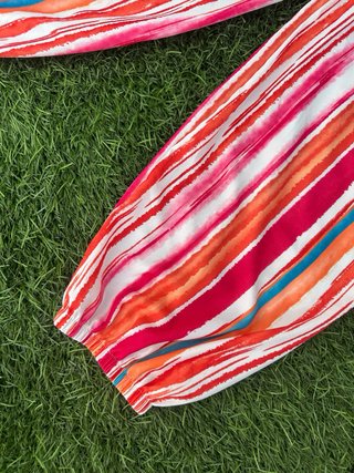 Pantalones bombachos fluidos rayas fluor tendencia