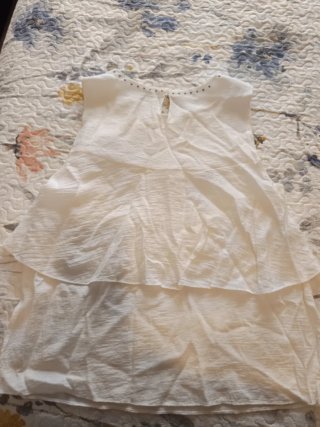Blusa sin mangas con tachuelas