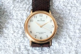 reloj cuarzo dorado-piel