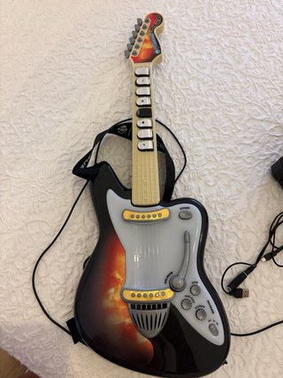 Guitarra con amplificador iDance