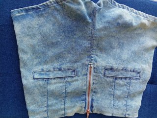 Short vaquero desgastado con cremallera