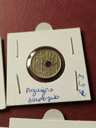 50 céntimos 1949 error agujero desplazado