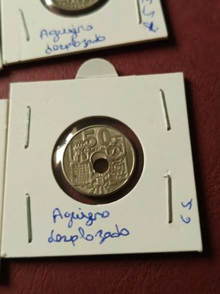 50 céntimos 1949 error agujero desplazado
