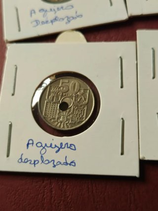 50 céntimos 1949 error agujero desplazado