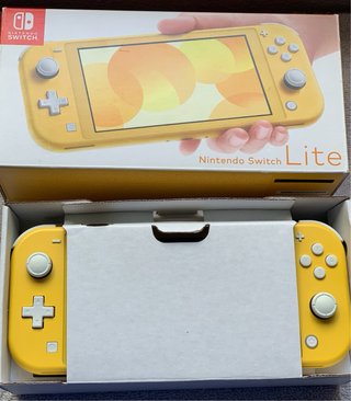 Nintendo Switch Lite + Caja manuales, carga.