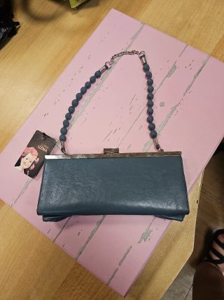 Bolso de fiesta gris con lazo