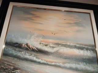 Cuadro de olas y atardecer realista
