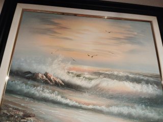 Cuadro de olas y atardecer realista
