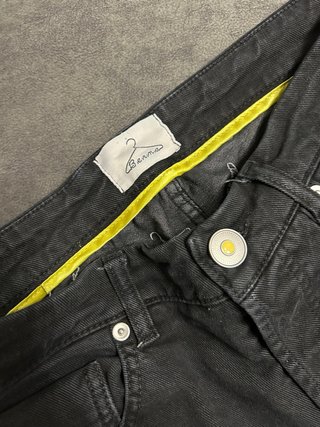Jeans neri strappati uomo