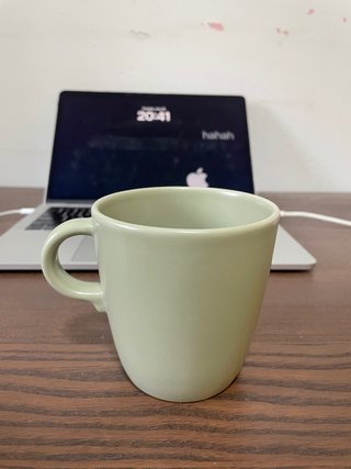 Taza verde de cerámica
