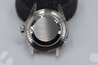 Caja Rolex Submariner Date bisel negro, con lupa