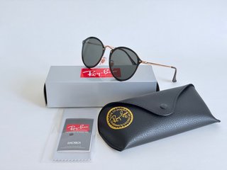 Gafas de sol Ray-Ban negras y doradas