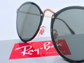 Gafas de sol Ray-Ban negras y doradas