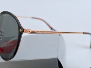 Gafas de sol Ray-Ban negras y doradas
