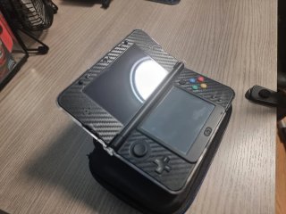 New 3DS con funda protectora