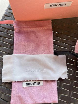 Occhiali da sole Miu Miu neri e oro