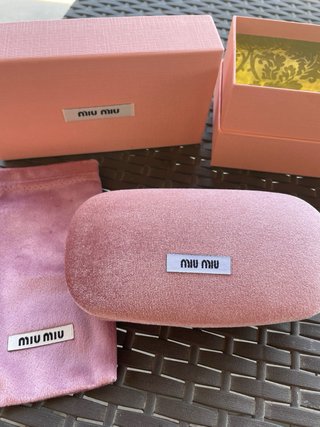 Occhiali da sole Miu Miu neri e oro