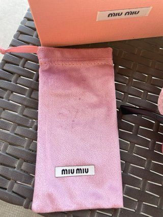 Occhiali da sole Miu Miu neri e oro