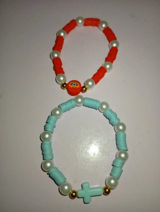 Pulseras de bolitas con ojo y cruz