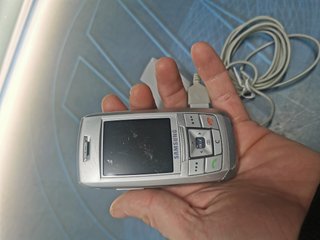 Teléfono, movil,  SAMSUNG SGH-E250 color plata- orange