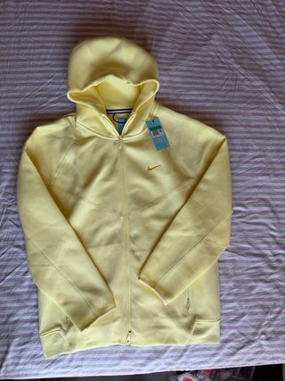 Chaqueta Nike Tech Fleece x Nocta Amarilla
