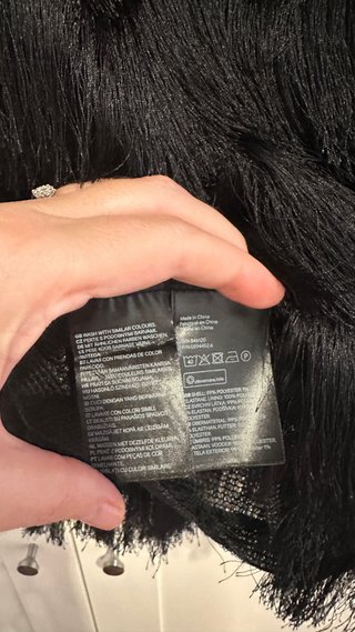 Top H&M negro con flecos