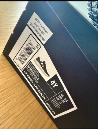 Sneakers Under Armour per bambini nere e bianche