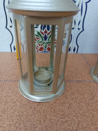 2 Portavelas dorados de metal y cristal