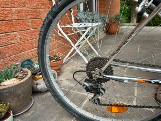 Bicicleta Orbea Plata y Naranja