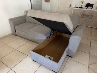 Sofá cama con chaise longue gris de tela