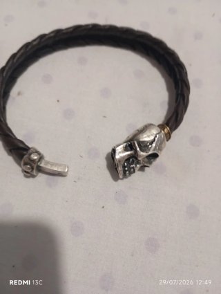 Pulsera cuero trenzado calavera plata
